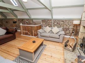 A living room with a sofa and coffee table at Millstone in Lucker