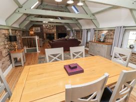 A dining room with a table and chairs at Millstone Lucker