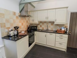 A kitchen with cabinets and appliances at Millstone in Lucker
