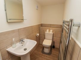 A bathroom with a sink and toilet at Millstone in Lucker