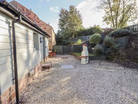 A garden with gravel and patio area at Millstone in Lucker