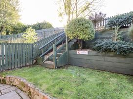 A garden with stairs and a fence at Millstone in Lucker