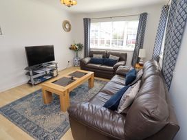 A living room with a television and coffee table at 6 Westview Embleton