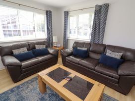 A living room with two sofas and a coffee table at 6 Westview in Embleton