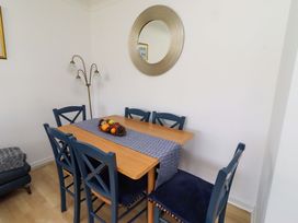 A dining room with a table and chairs at 6 Westview in Embleton