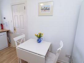 A kitchen with a table and chairs at 6 Westview in Embleton