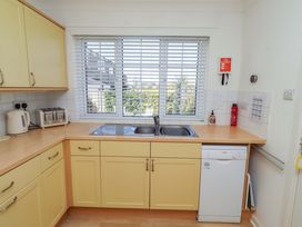 A kitchen with a sink and appliances at 6 Westview in Embleton