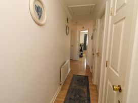 A hallway with doors and a radiator at 6 Westview in Embleton