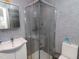 A bathroom with a shower, sink, and toilet at 6 Westview in Embleton