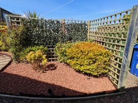 A garden with bushes and a gravel area at 6 Westview Embleton