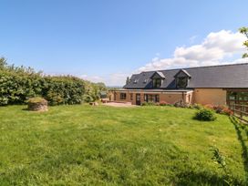 An outdoor space with a house and garden at Palace Farmhouse St Weonards