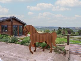 A horse sculpture in a garden outside a house at Palace Farmhouse in St Weonards