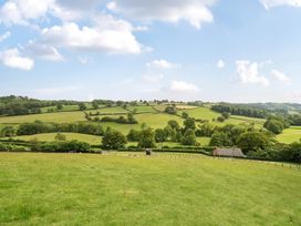 A landscape with fields and trees at Bwncath in Garthmyl