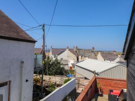 A view of rooftops and gardens at Ty Haul in Rhosneigr