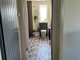 A bathroom with a toilet and sink at How Hill Farm Cottage in Greystoke