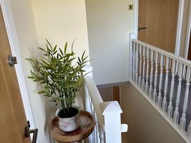 A hallway with a plant on a tray at How Hill Farm Cottage in Greystoke