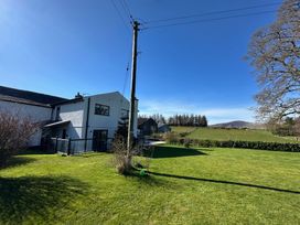 A house and garden area at How Hill Farm Cottage in Greystoke