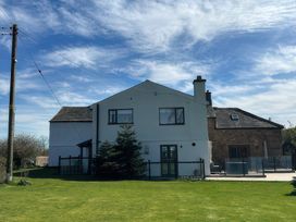 A house with garden and fence at How Hill Farm Cottage Greystoke