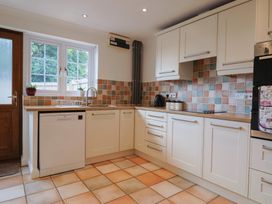 A kitchen with a sink and appliances at Rainbow View Churchstanton near Churchinford