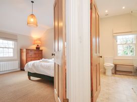 A bedroom with a bed and dresser at Mermaid Cottage in Port Isaac