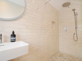A bathroom with a shower and sink at Mermaid Cottage in Port Isaac