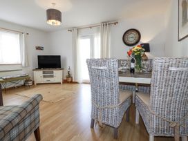 A dining room with a table and chairs at Flat 4 in Newquay