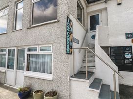 An outdoor area with stairs and an ice cream sign at Harbour Studio in Sennen Cove