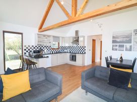 A kitchen with counter and dining area at Lodge 1 in South Hykeham