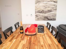 A dining room with a table and champagne at Lodge 2 South Hykeham