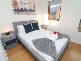 A bedroom with a bed and bedside table at Lodge 2 in South Hykeham