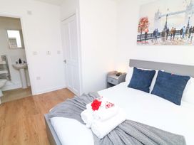 A bedroom with a bed and attached bathroom at Lodge 2 in South Hykeham