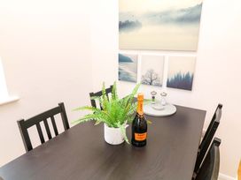 A dining room with a table and chairs at Lodge 7 South Hykeham