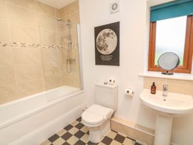 A bathroom with a bathtub and shower at Lodge 7 in South Hykeham