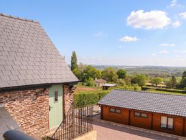 An outdoor view with buildings and trees at Palace Studio St Weonards