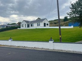 A house on a grassy hill at Rockville in Greencastle, County Donegal
