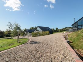 A driveway with gravel leading to buildings at Stags Mount Thornton Dale