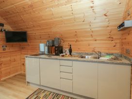 A kitchen with a sink and appliances at Holly in Ulverston