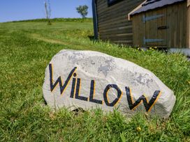 A rock with the name Willow in front of a building in Ulverston