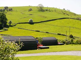 A view of green hills and barns at Willow in Ulverston