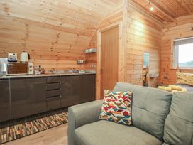 A kitchenette with a sofa and appliances at Oak in Ulverston