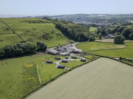 A farm with multiple buildings and fields at Rowan in Ulverston
