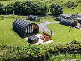 An outdoor area with huts and benches at Rowan in Ulverston