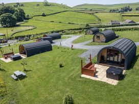 An outdoor area with cabins and hot tubs at Rowan in Ulverston