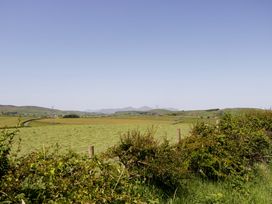 A view of fields and hills under a clear sky at Cherry in Ulverston