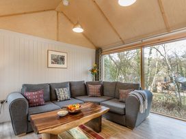 A living room with a sofa and coffee table at Lodge 14 in Corfe Castle