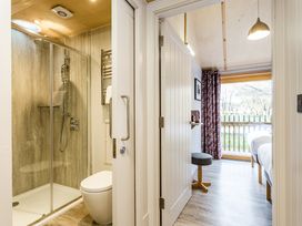 A bathroom with a shower and toilet at Lodge 18 Corfe Castle
