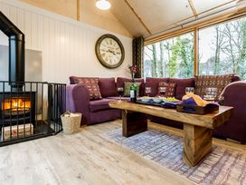 A living room with a coffee table and a fireplace at Lodge 19 in Corfe Castle