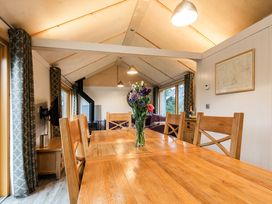 A dining room with a table and chairs at Lodge 19 in Corfe Castle