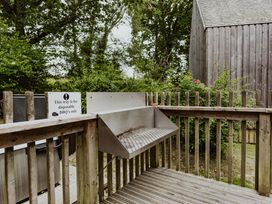 An outdoor BBQ tray on a wooden deck at Lodge 19 in Corfe Castle