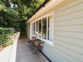 An outdoor area with a table and chairs at 15 The Dell Mundesley